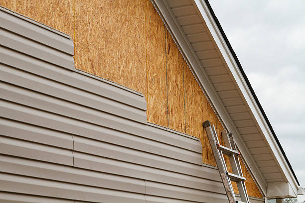 Professional Siding Replacement technician working in New Philadelphia, OH